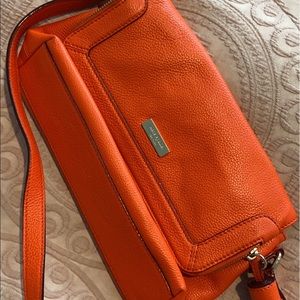 Orange Kate Spade Crossbody purse.